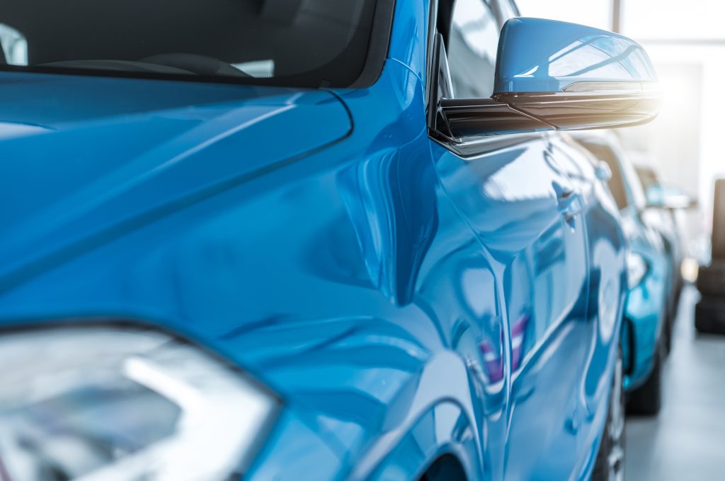 Close-up of a car with a ceramic-coated glossy finish